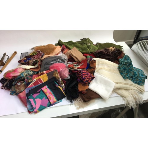 499 - A mixed box of headscarves, some silk, scarves and wraps, gloves and socks, and fabric purses