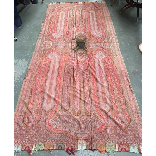 511 - A very large paisley shawl, 315x140cm; together with a tapestry, 47x69cm (2)