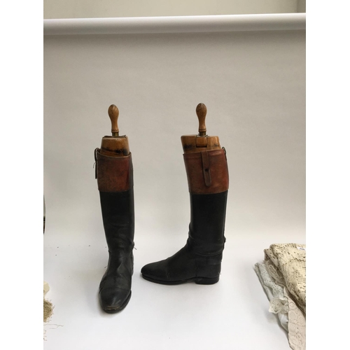 576 - A pair of gent's black leather hunting boots with mahogany tops, patch repairs, approx. size 9.5, wi... 