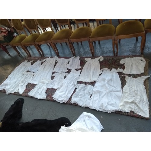 480 - A large quantity of christening gowns, some early