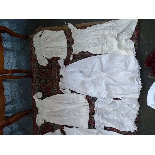 480 - A large quantity of christening gowns, some early