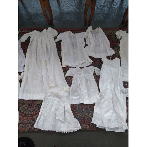 480 - A large quantity of christening gowns, some early