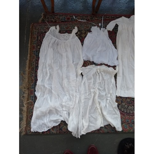 480 - A large quantity of christening gowns, some early