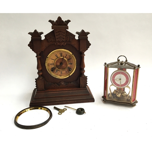 17 - A carved American mantel clock (af), with key and pendulum, marked Ansonia Clock Co. New York; toget... 