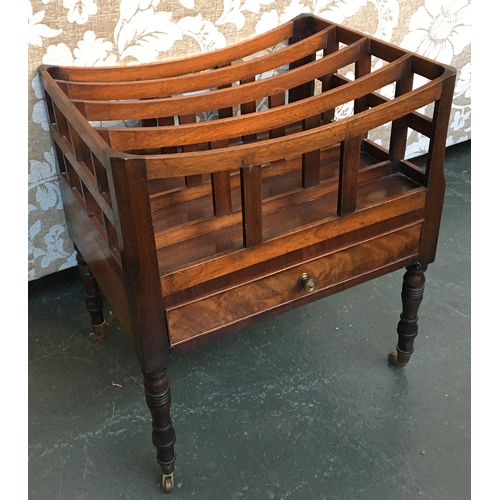 474 - An oak and mahogany five-sectioned canterbury, single drawer on turned legs, with brass casters