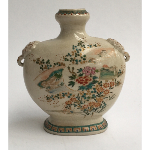 41 - An antique Japanese Meiji period enamelled vase with elephant lugs, decorated with views of Mount Fu... 