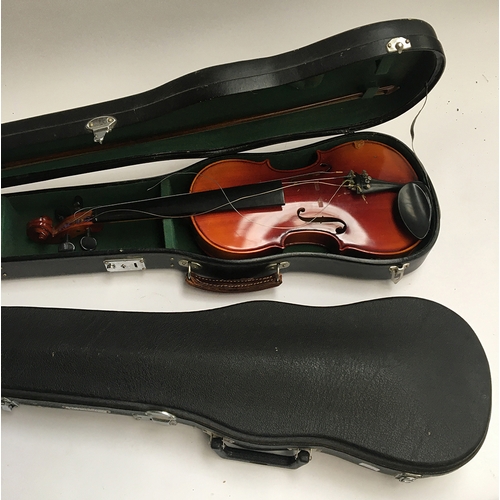 128 - A Chinese student violin, together with a Chinese Skylark 3/4 size violin