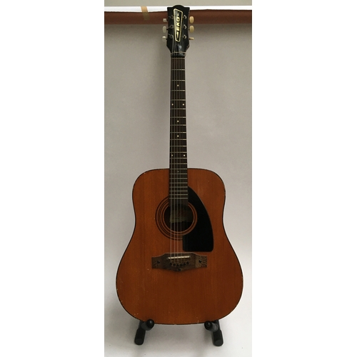 137 - An Eko acoustic guitar, model Grande VI (some damage), in soft case