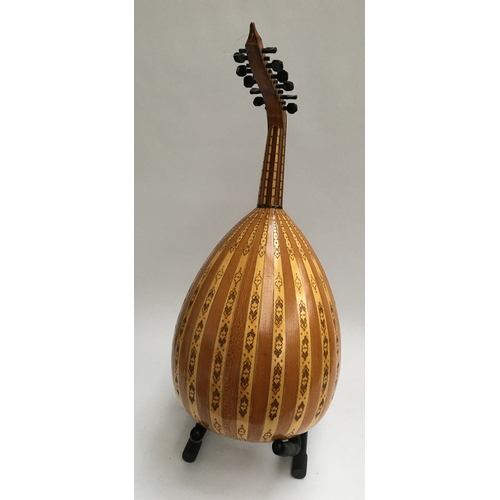 145 - A bowlback 12 string Oud, with a soft case