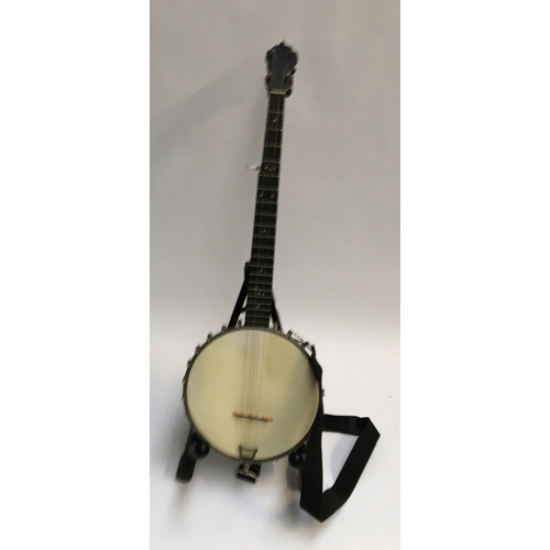 146 - A five string banjo in soft case