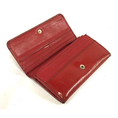 238 - A red leather Burberry purse