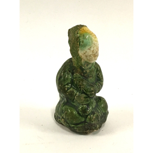 30 - Japanese sansai figurine of a sitting figure holding a rabbit, c.1800, 7.5cmH