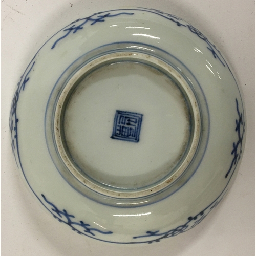 35 - A small Japanese porcelain plate, blue and white with lucky charm plant and bamboo design, marks to ... 