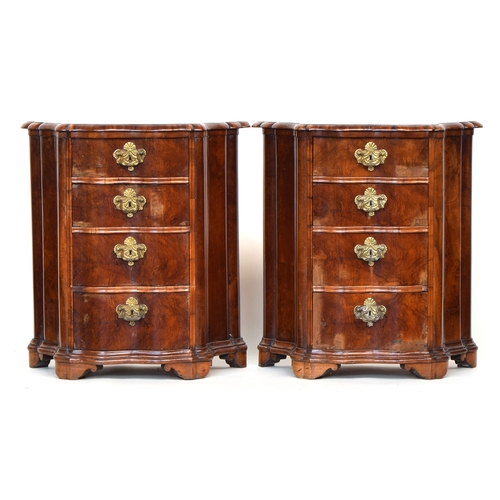 633 - A pair of 18th century German Rococo side cupboards, shaped and serpentine form, each with four grad... 