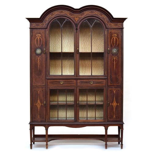 606 - An Edwardian inlaid double dome glazed bookcase on stand, by Trevor Page & Co., Norwich, 148cm wide,... 