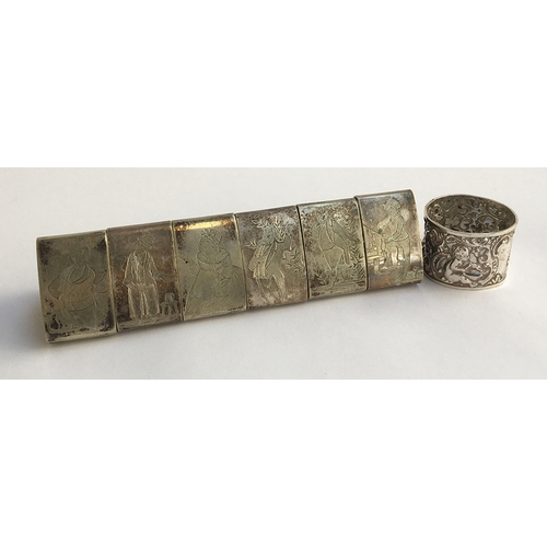 56 - A set of six triangular silver plated napkin rings, each engraved with a figure; together with a sil... 