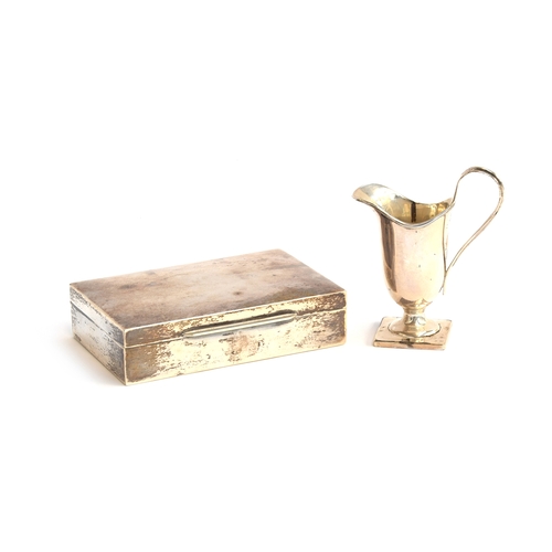 106 - A silver cigarette box marked 925 stirling, 13.5cm wide; together with a small silver milk jug