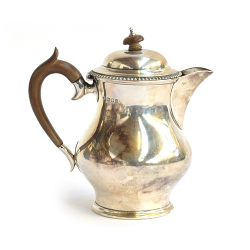 62 - A George V silver coffee pot, by Edward Barnard & Sons Ltd, London 1935, carved wood knop and handle... 