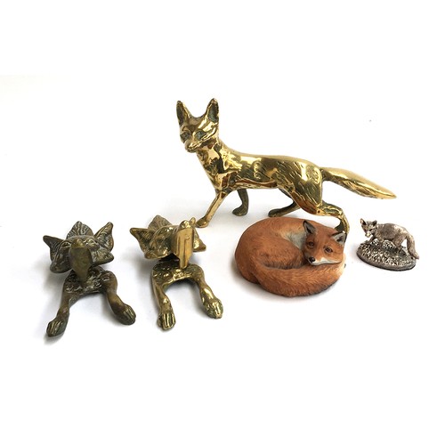 87 - A pair of knockers in the form of fox masks; a brass fox figurine and two other fox figures