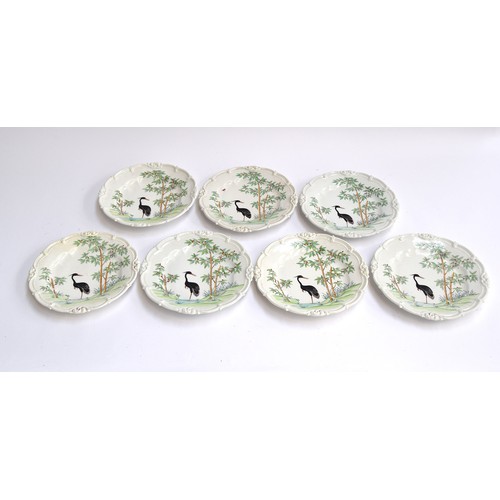 224 - A set of Ed Honore á Paris hand painted porcelain cabinet plates, decorated with images of a black c... 