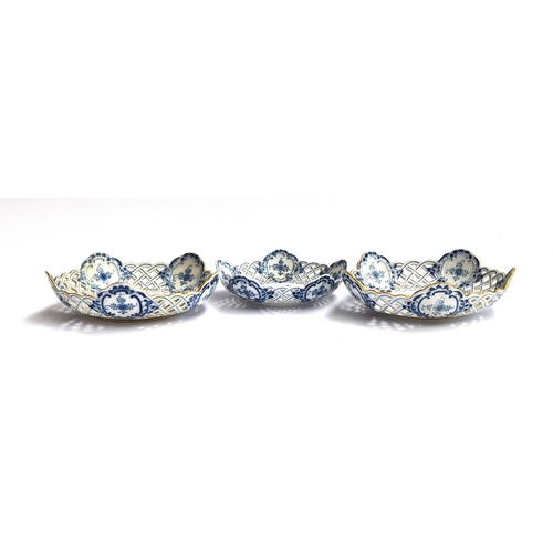 212 - Three Meissen blue and white 'Blumen' pattern baskets with pierced lattice borders, the two larger 2... 