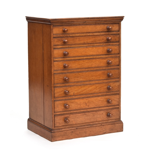 635 - A late 19th century oak specimen cabinet, moulded top over eight drawers, on plinth base, 43cm wide,... 