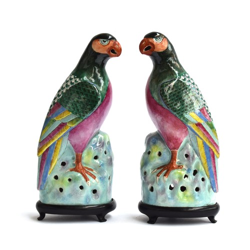 181 - A pair of 19th century famille rose porcelain parrots, decorated with patterned wings with multicolo... 