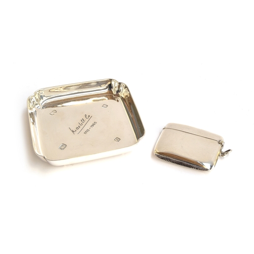 121 - A George VI silver vesta case, by W J Myatt & Co, Birmingham 1939; together with a silver ashtray, L... 