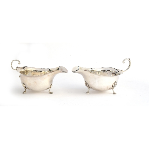 84 - A near pair of silver sauce boats by George Nathan & Ridley Hayes, Chester 1915 and Adie Brothers Lt... 