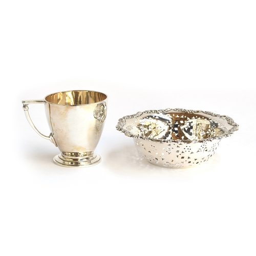 104 - A silver christening cup by William Comyn & Sons, London 1936, 8.2cm high; together with a pierced s... 