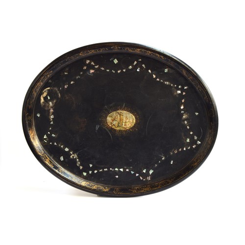 161 - A 19th century ebonised papier mache tray, with mother of pearl inlay border surrounding a scene of ... 