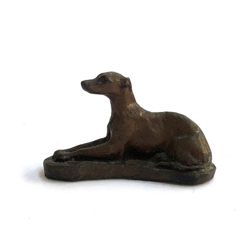 122 - A bronze figure of a whippet, 13.5cmH, on oak base; with one smaller, 4.5cmL