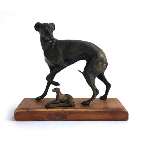 122 - A bronze figure of a whippet, 13.5cmH, on oak base; with one smaller, 4.5cmL