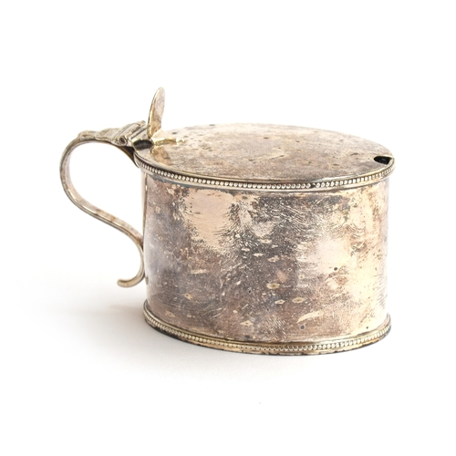 72 - A George III silver mustard by Robert Hennell I, London 1784, of oval form, with beaded rim and base... 