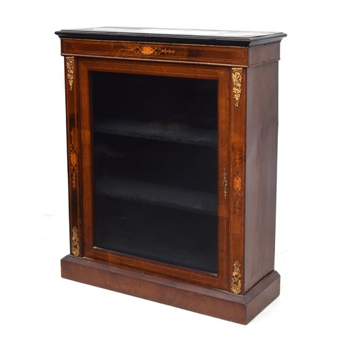 601 - A small mahogany, marquetry and ormolu mounted glazed bookcase, the door opening to a baize lined in... 