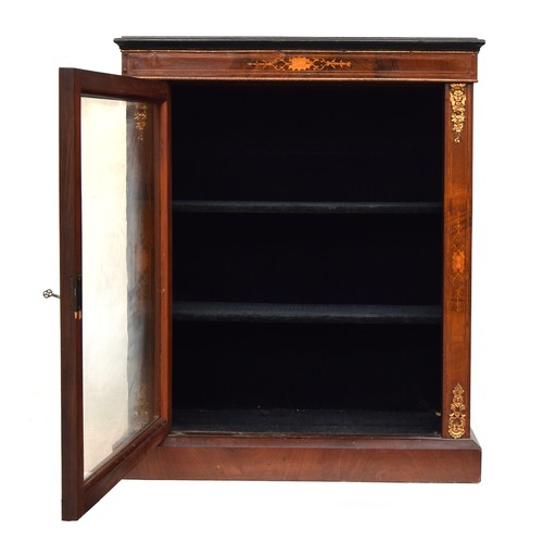 601 - A small mahogany, marquetry and ormolu mounted glazed bookcase, the door opening to a baize lined in... 