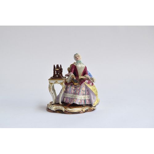 203 - A 19th century Meissen group of a seated lady at a spinning wheel, 'The Good Housekeeper' or 'Leseri... 