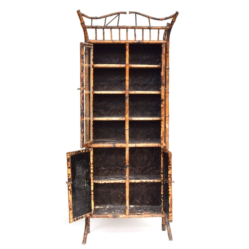 638 - A Victorian tiger bamboo display cabinet, comprising a pair of glazed doors over a further pair of p... 