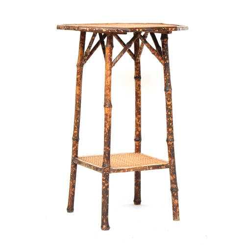 639 - An octagonal tiger bamboo occasional table, 46cm diameter, 72cm high