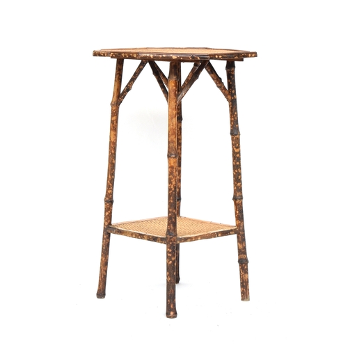 639 - An octagonal tiger bamboo occasional table, 46cm diameter, 72cm high