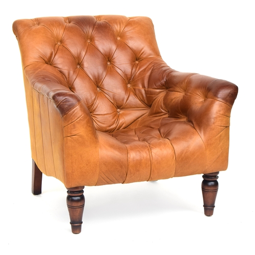 644 - A 20th century button back low leather armchair