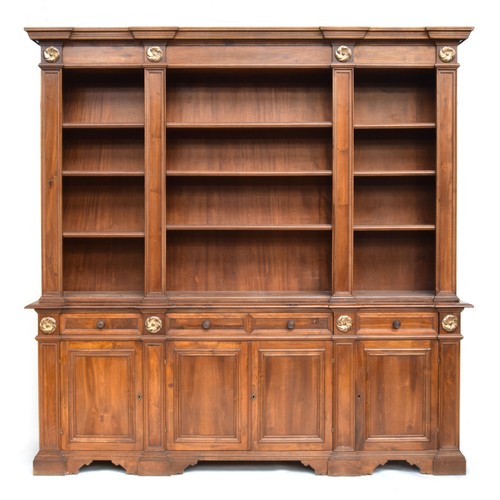 605 - A substantial mahogany bookshelf, with three sections of adjustable shelves, applied gilt roundels b... 