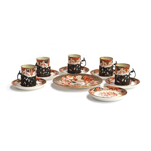 219 - A Crown Derby part coffee can set comprising six saucers, five cans (one af) with silver sleeves, pa... 