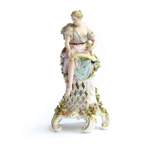 195 - A Carl Thieme figural centrepiece depicting a lady seated upon a pierced plinth holding a cornucopia... 