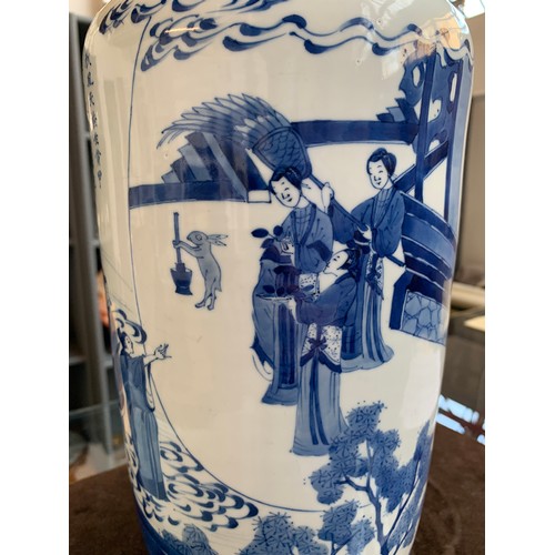 183 - A 19th century blue and white Chinese rouleau vase, depicting court scenes and a landscape amidst sw... 