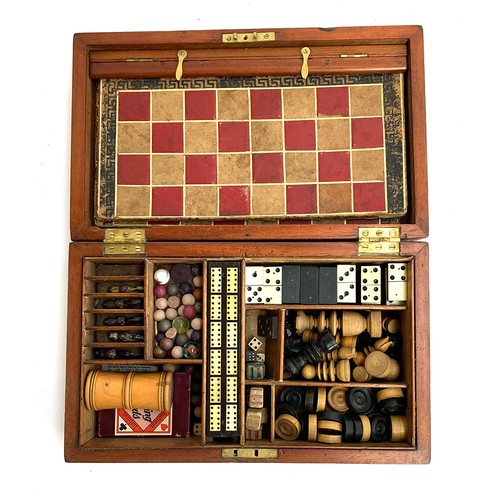 30 - A 19th century mahogany cased compendium of games to include chess and backgammon boards and pieces;... 