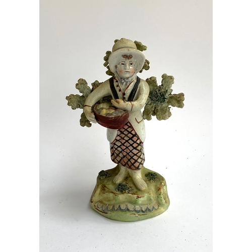 24 - A Walton Pearlware figure of a girl with Walton mark to reverse