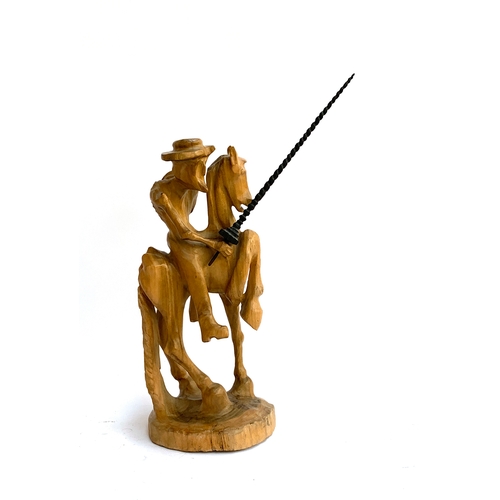 106 - A wooden carving of Don Quixote, 43cmH, 51cmH to tip of lance