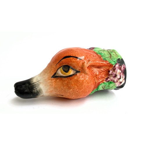 105 - A Royal Staffordshire fox mask stirrup cup, with grape decoration 12.5cm