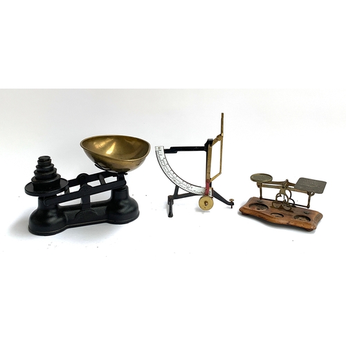 128 - A set of kitchen scales with weights; a quadrant balance and a set of postal scales (sans weights)